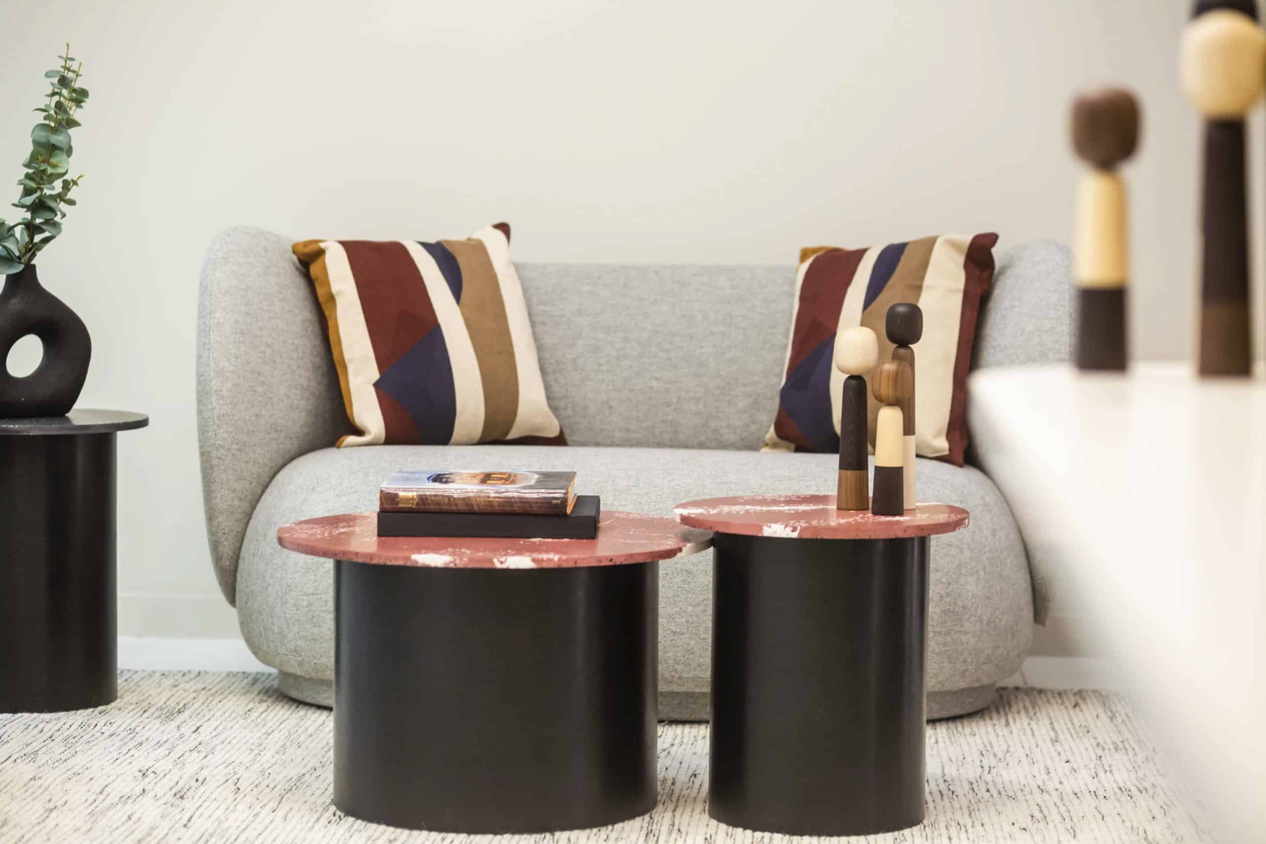 Preventicum welcome area - a couch with two round coffee tables made from Spared plastic waste